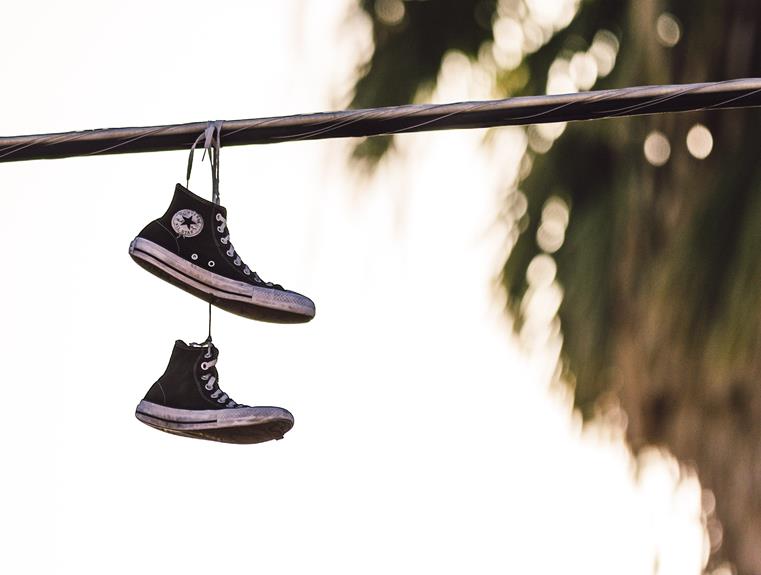 symbolism of shoes hanging